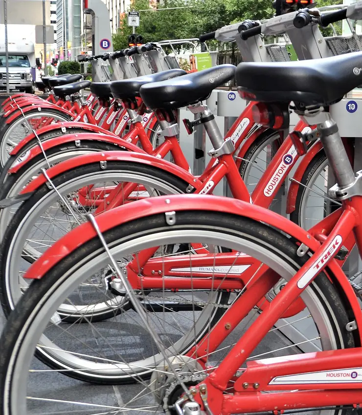 Red Frelo hire bikes at a rental station